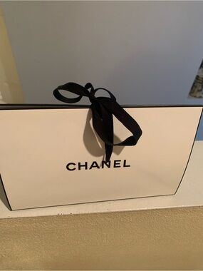 CHANEL Gift Bag with Black Ribbon with face cream samples and perfume sample